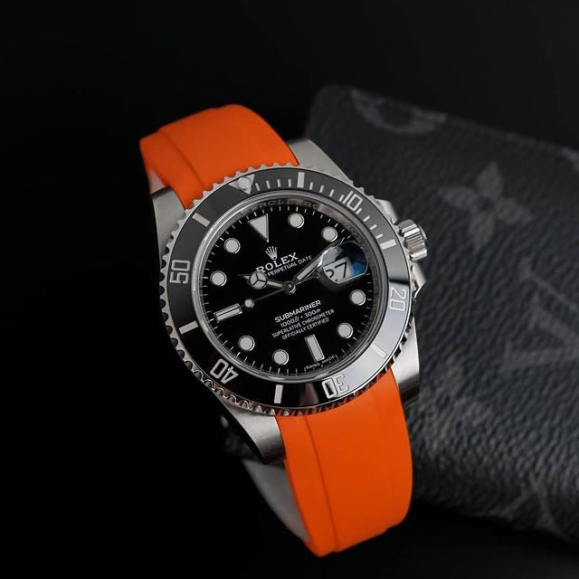 Rolex black submariner with orange strap