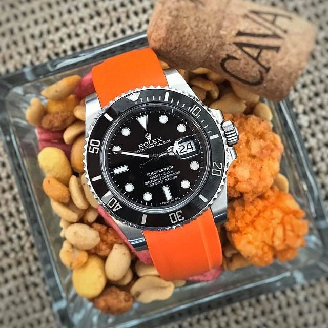 Rolex black submariner with orange strap