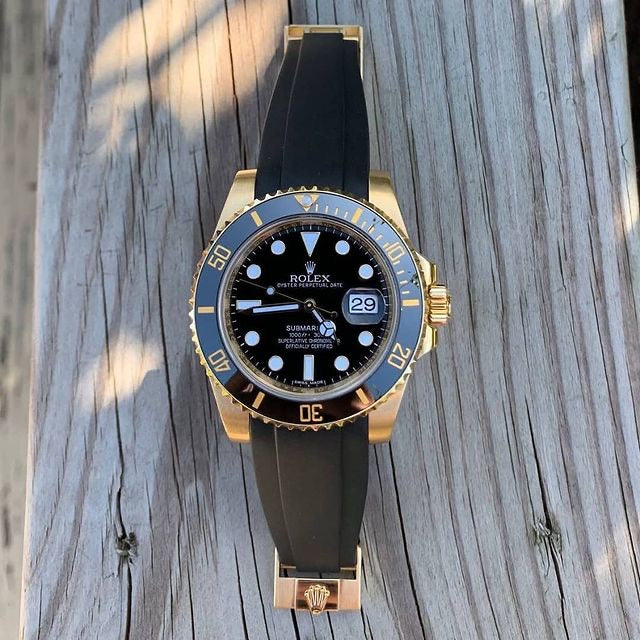 Rolex black submariner with green strap