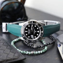 Rolex black submariner with green strap